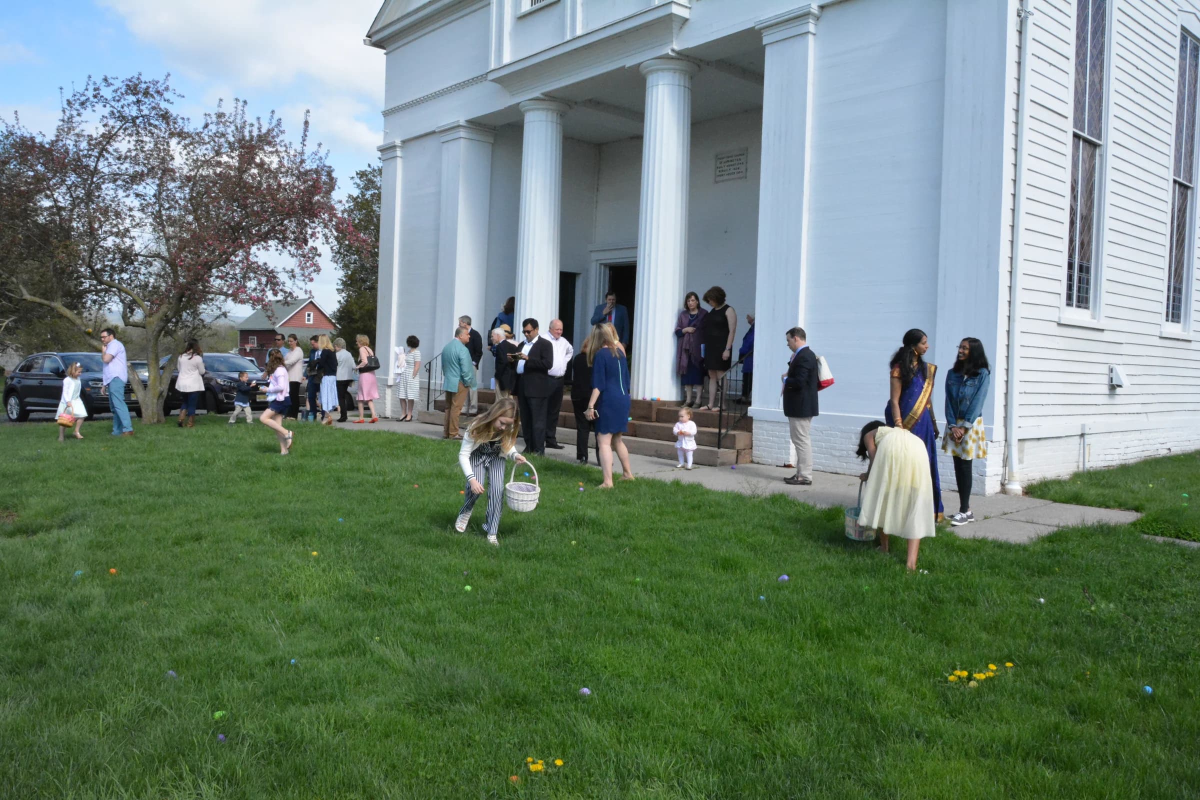 Children and families spending time together on the church lawn
